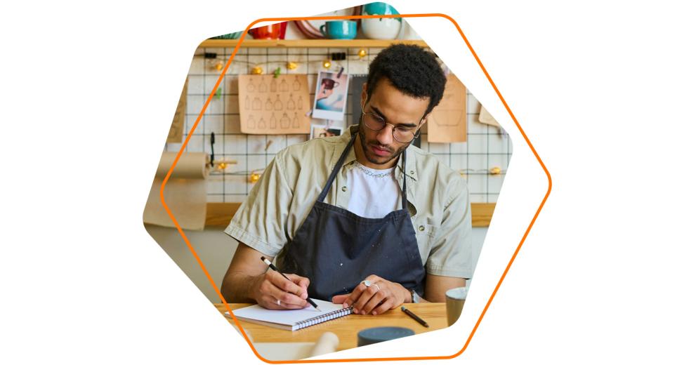 Image of a young man working in a small business venue