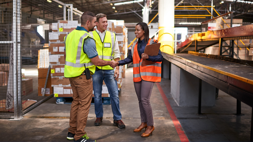 People standing in an industrial warehouse