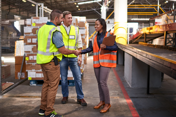 People standing in an industrial warehouse